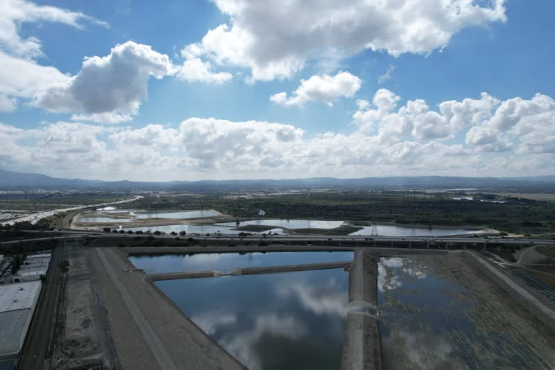 Aerial photo of spreading basins under a cloudy sky